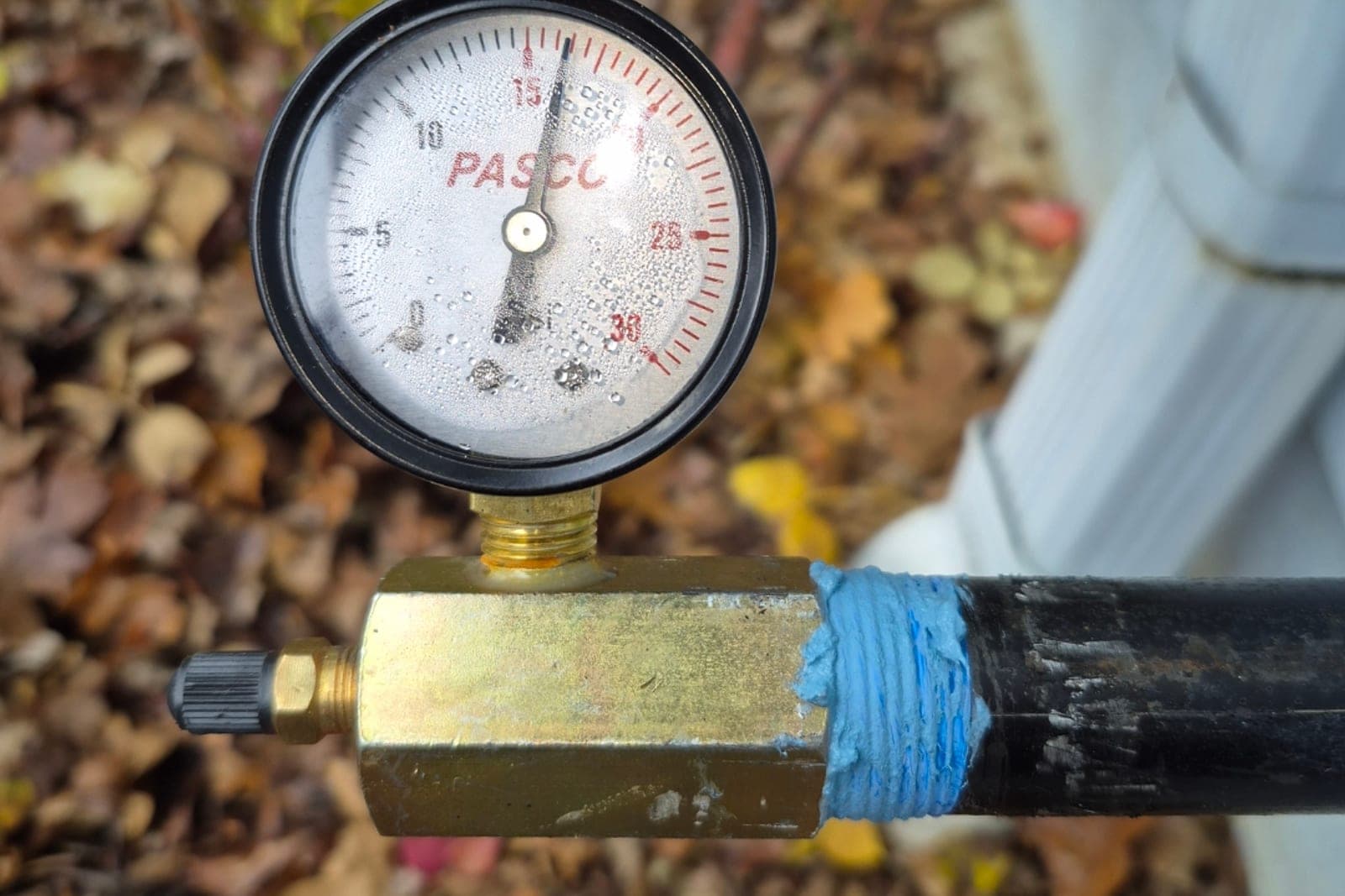 Pressure gauge testing a gas line for leaks